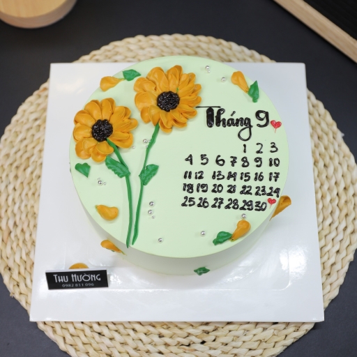 Bánh sinh nhật viết lịch với hoa hướng dương